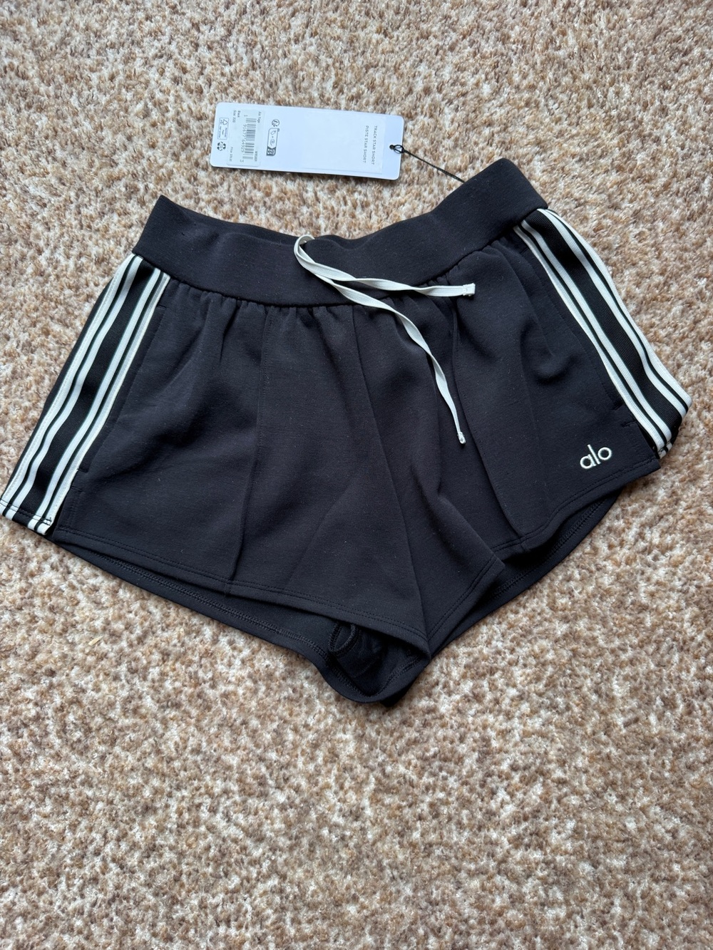 ALO Yoga Track star shorts size xxs Black Athletic Shorts with White Stripes